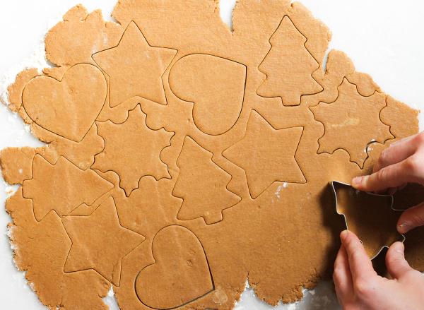 gingerbread coo<em></em>kies cut into shapes with coo<em></em>kie cutter